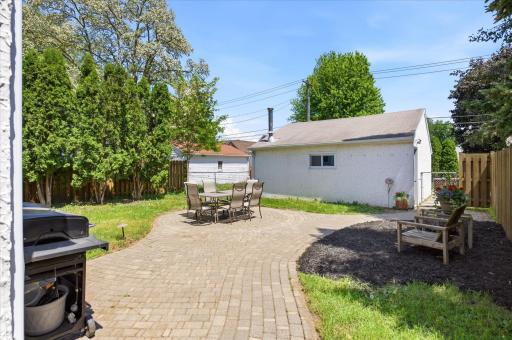 Check out that paver patio and walkway...stretches from front patio around home and back to this large area.