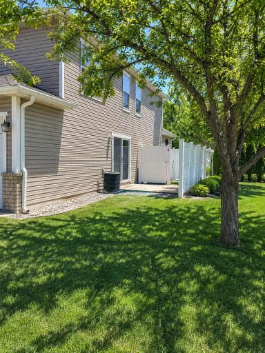 Private side patio & tons of green space!