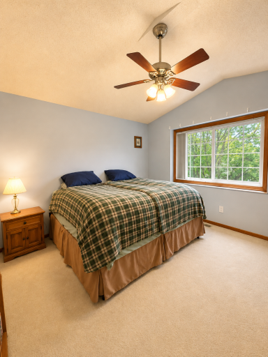 Primary suite offering vaulted ceilings, a walk-in closet and a walk-through Full Bathroom!