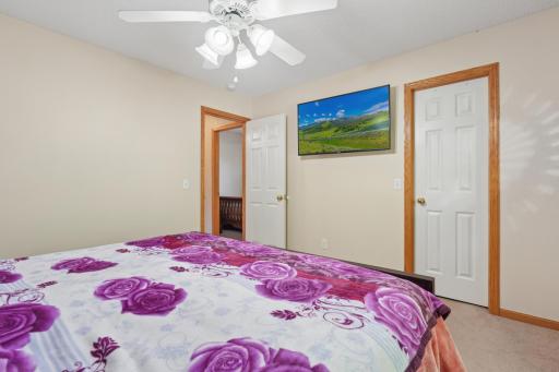 The primary bedroom features a walk-in closet, offering plenty of room for clothing, shoes, and storage.