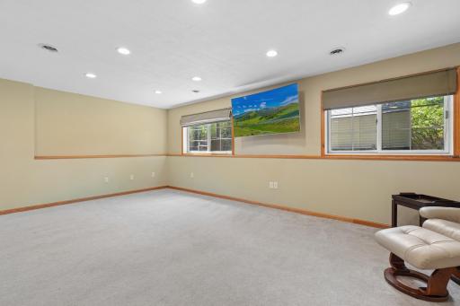 Two large windows fill the family room with natural light, creating a bright and welcoming space.