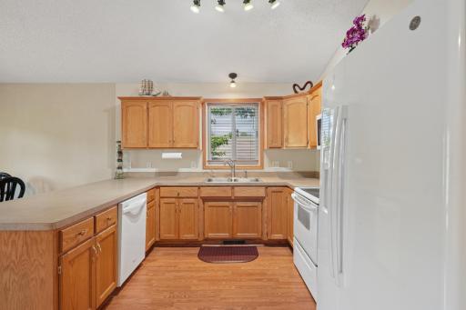 A window above the kitchen sink fills the space with natural light and offers pleasant view of the yard while you work.