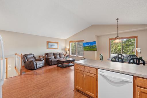 The large peninsula/breakfast bar provides ample seating and prep space, making it perfect for entertaining guests or enjoying casual meals