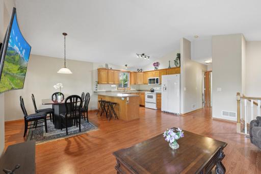 Open and spacious upper level featuring vaulted ceilings and beautiful flooring, creating a bright and inviting space thats perfect for everyday living and entertaining.