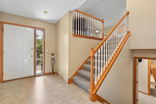 Huge front entry/mudroom with plenty of space for coats, shoes, and storage, plus convenient access to the backyard, making it perfect for busy households and outdoor entertaining.