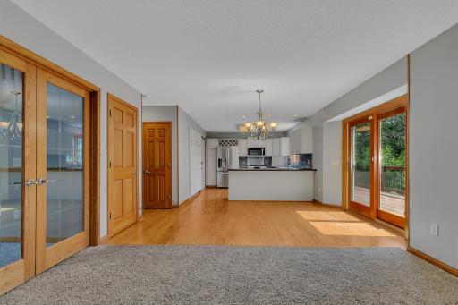 Engineered hardwood flooring flows throughout much of the main level, including the dining area and kitchen.