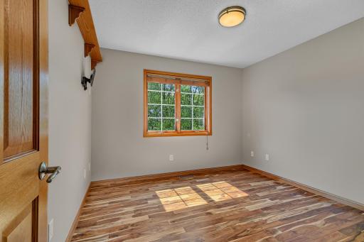 The third bedroom showcases the same attractive maple hardwood flooring found in the primary suite.