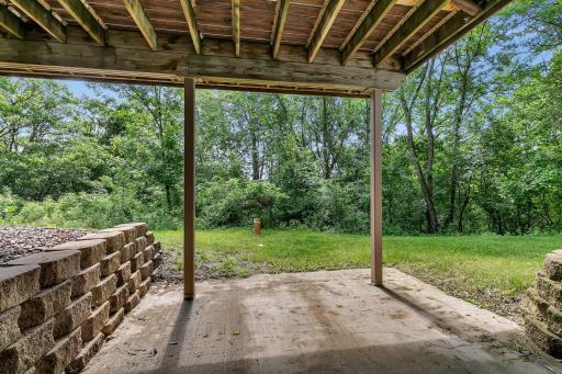 An Andersen patio door leads to an 11' x 11' concrete patio beneath the deck, providing another wonderful place to enjoy the private backyard setting.
