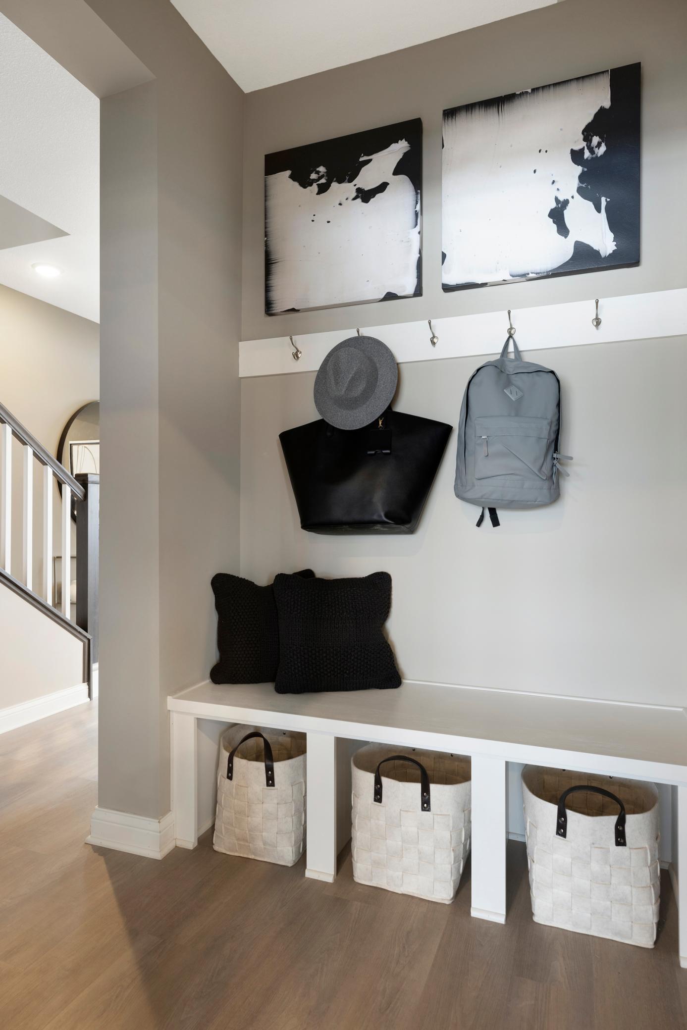 Model Home Photo. Boot bench area and powder room.