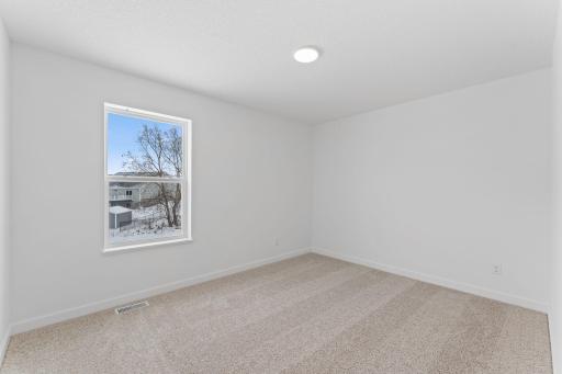 Photo of a similar home, actual finishes may vary