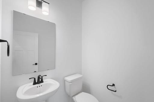 A first-floor powder room is easily accessible from the communal living and dining spaces.