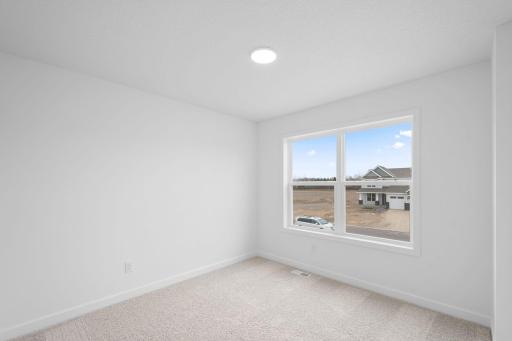 Three secondary bedrooms are situated upstairs, just down the hall from the ownerâs suite.
