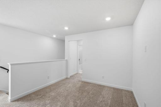 Found at the top of the stairs, the loft is a versatile space and can be used as an additional living area or home office.