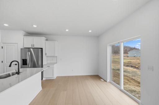 Conveniently located just steps away from the kitchen, the dining room is perfect for entertaining and having meals with friends and family.