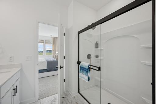 (Photo of a decorated model, actual homes finishes will vary) Another view of the primary bath.