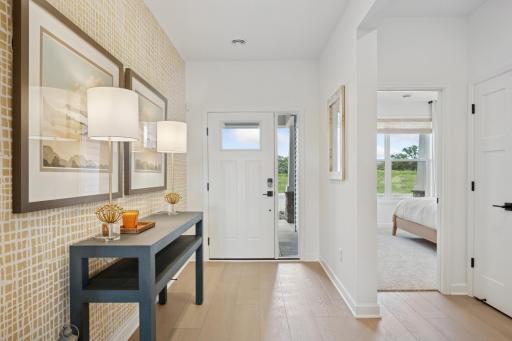 (Photo of a decorated model, actual homes finishes will vary) Make the best first impression with this bright and open foyer.