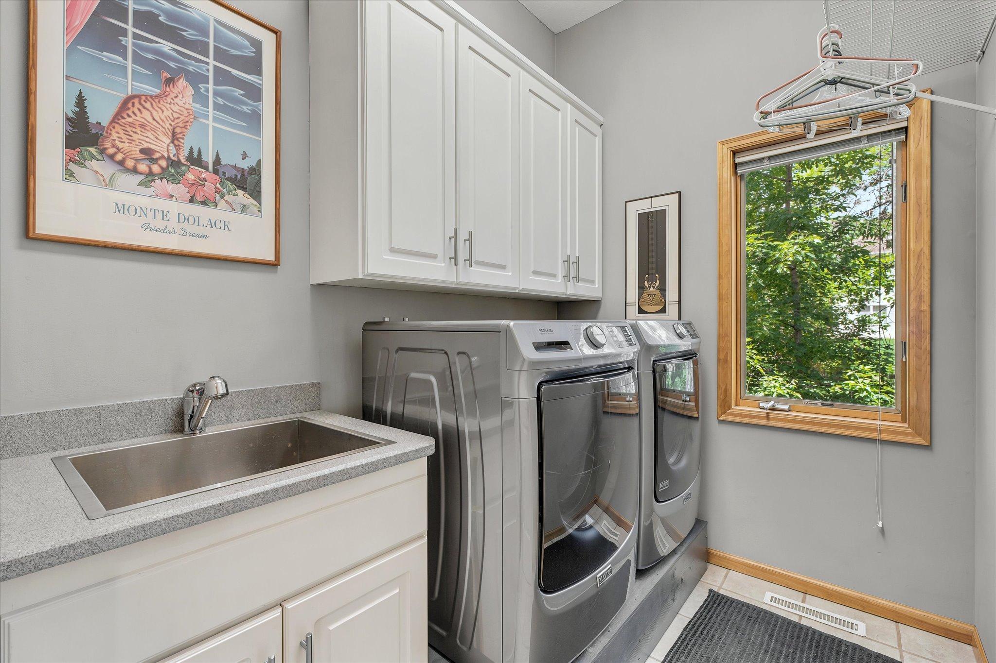 Main Floor Laundry w/sink & cabinets