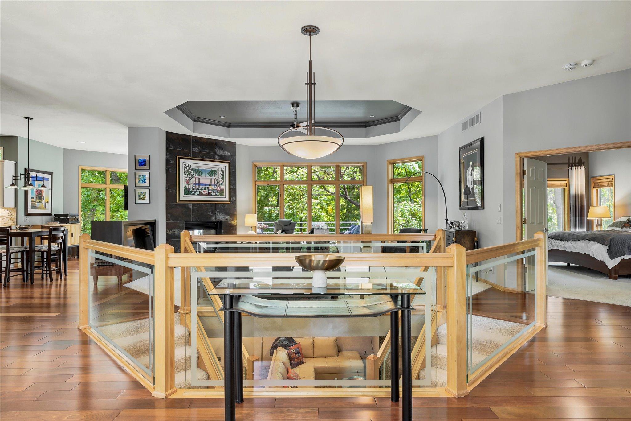 Foyer opens to Glass,Dual,Staircase