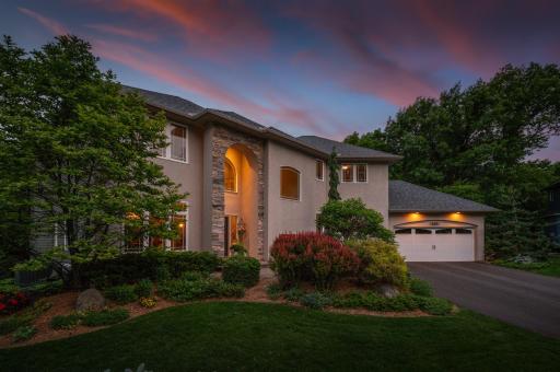 Meticulously maintained landscaping showcases pride of ownership at every turn.