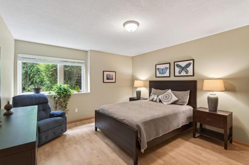 A private sixth bedroom offers the perfect space for guests, extended family, or a home office.