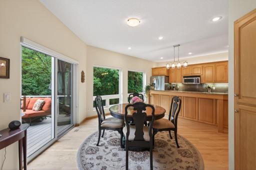 Casual dining with beautiful views of the backyard and surrounding nature.