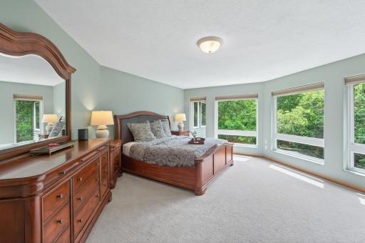 Wake up to peaceful wooded views from the comfort of your private retreat.