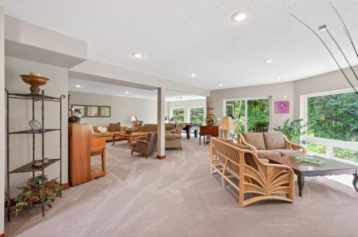 A spacious lower-level family room creates the perfect place to gather and unwind.