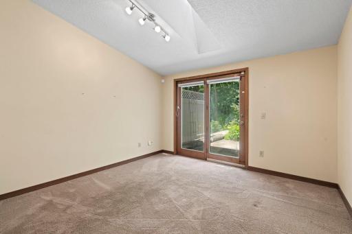 Main Level Living Room With Vaulted Ceiling & Skylight