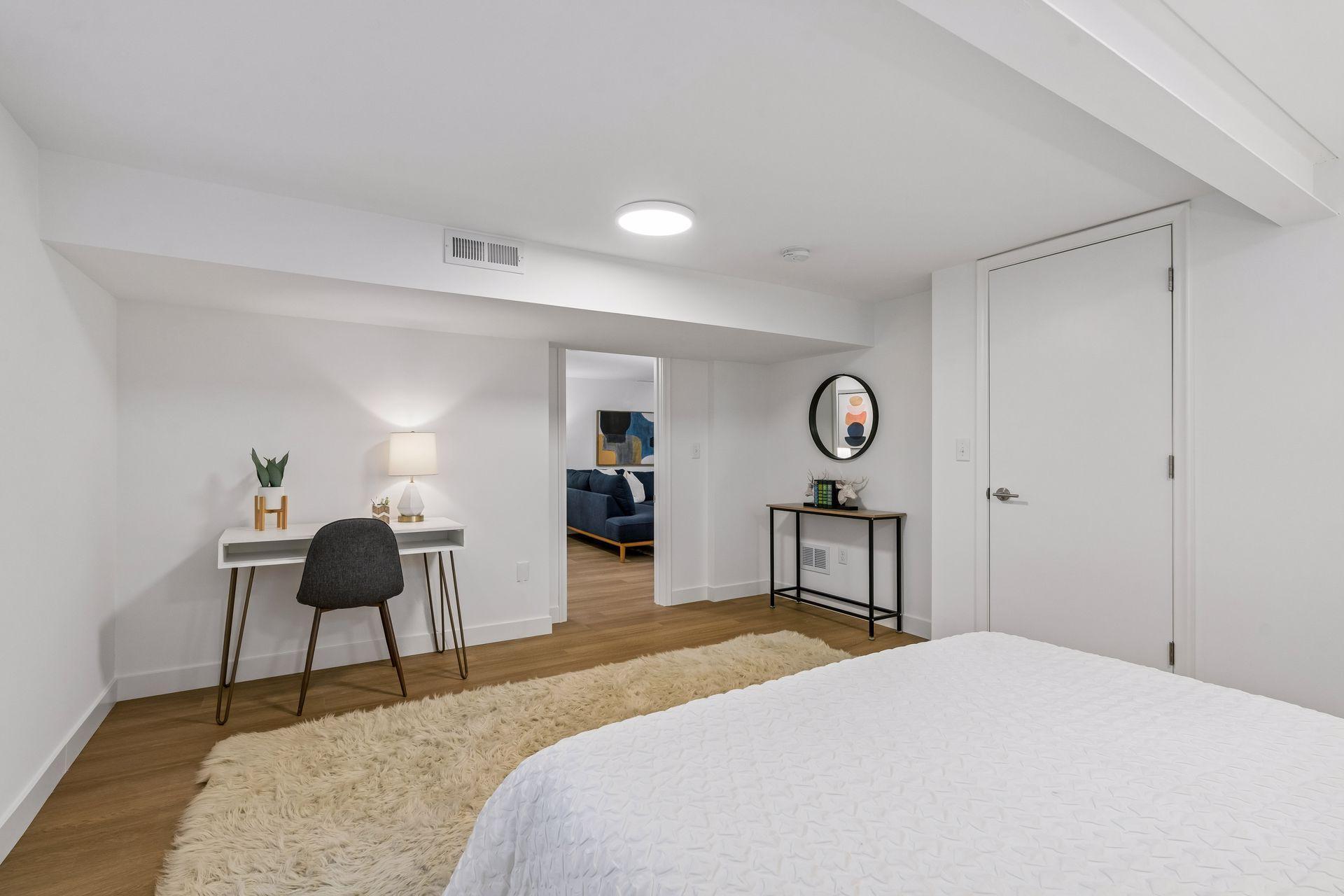 16x13 Lower Level Bedroom #3 with East and north-facing updated Glass block window, New East-facing Egress window, new paint, New trim and closet door, new luxury vinyl flooring, and lighting.
