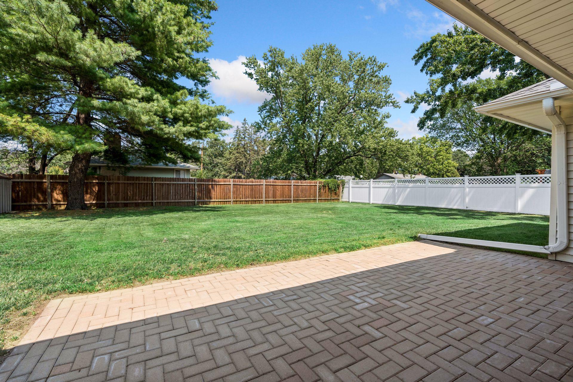 Partially fenced backyard and New Paver patio