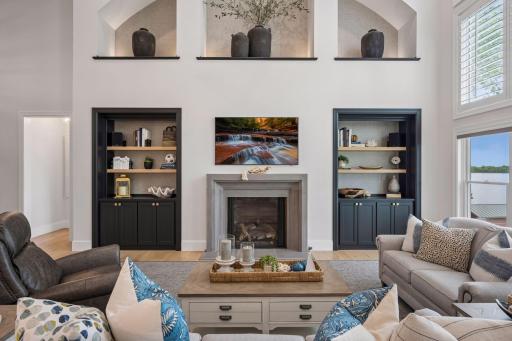 Custom built ins and stone surround gas fireplace
