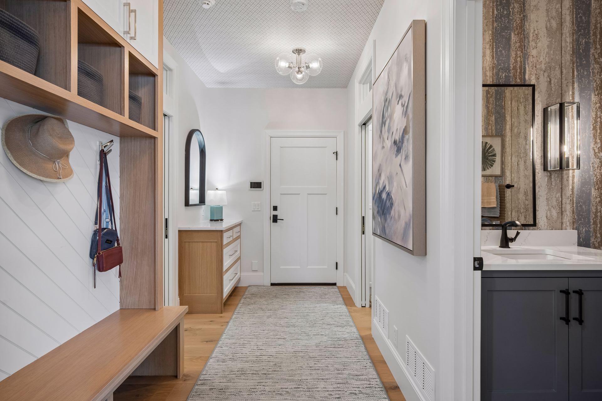 Entryway from garage with drop station & custom built bench.