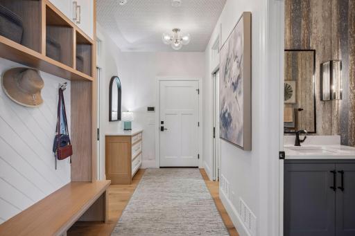 Entryway from garage with drop station & custom built bench.