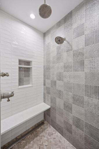 Walk in tile shower with heated floor, dual shower heads including a rain head.