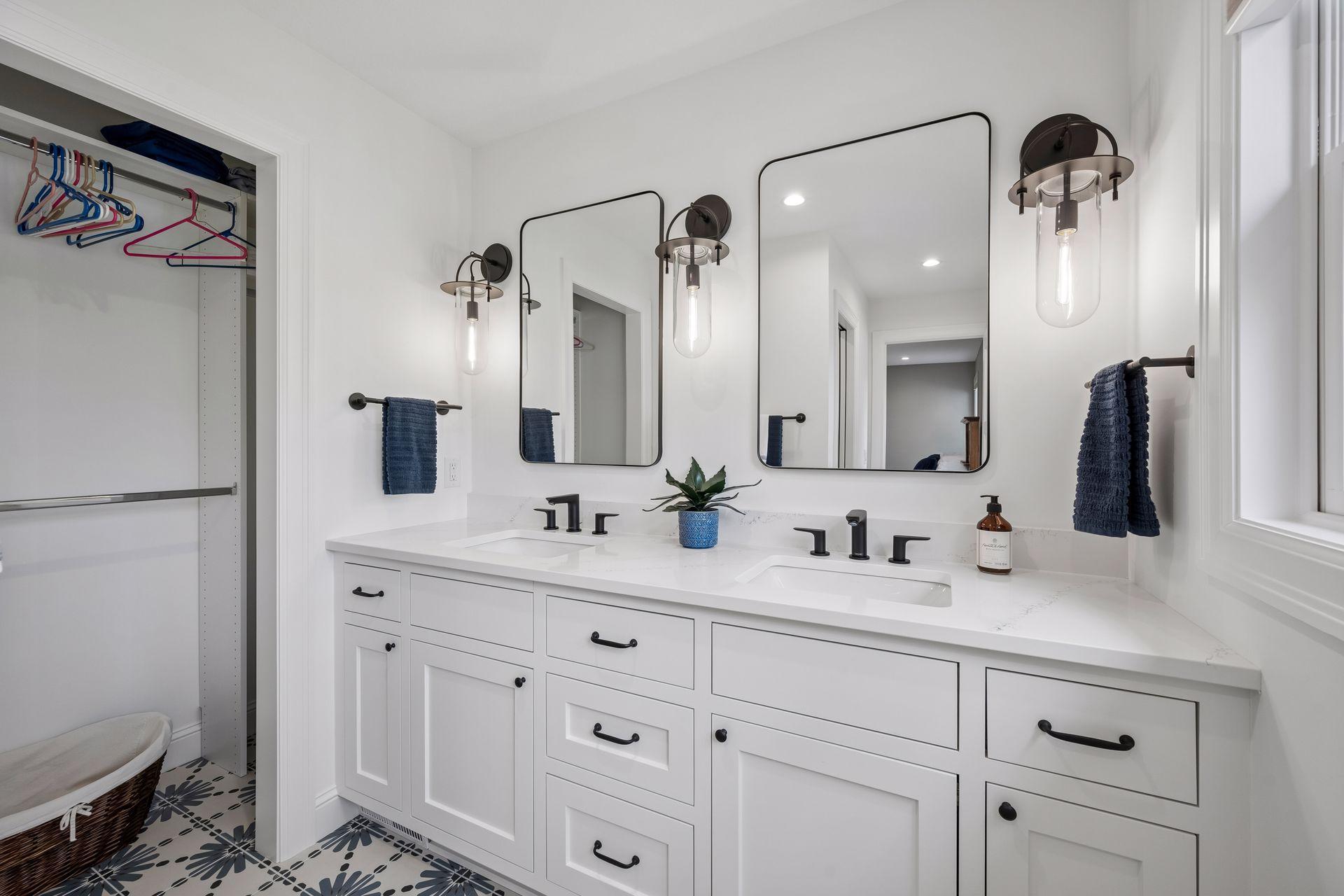 Private bathroom (bedroom 1) double vanity, granite counter tops, tile floors and closet space.