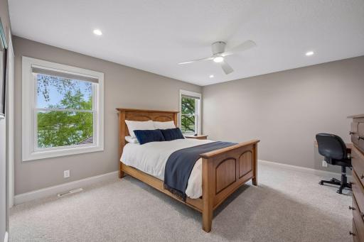 Bedroom 1 on upper level with a private en suite bathroom.
