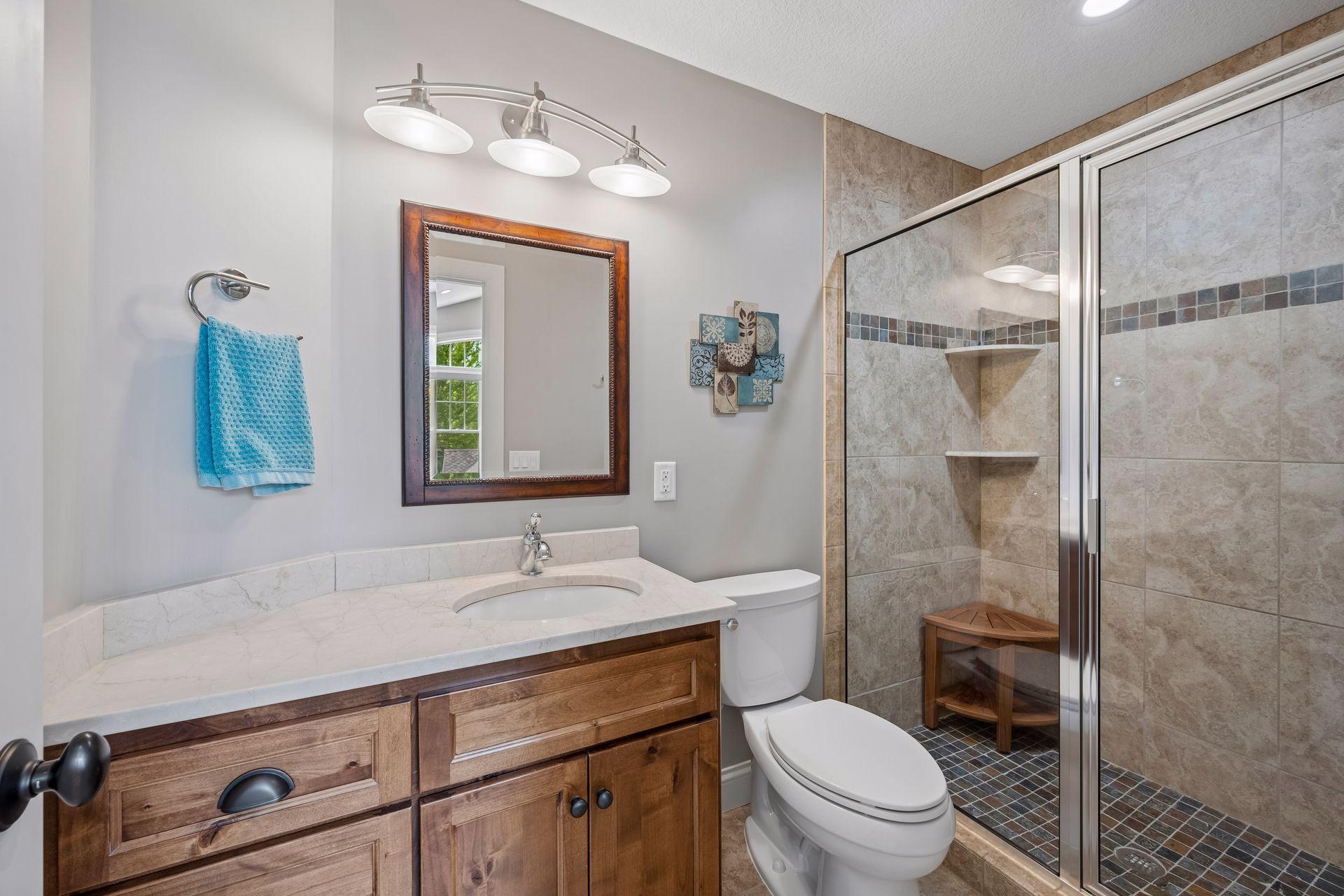 Private bathroom (bedroom 3) granite counter tops, tile floors and walk in tile shower.