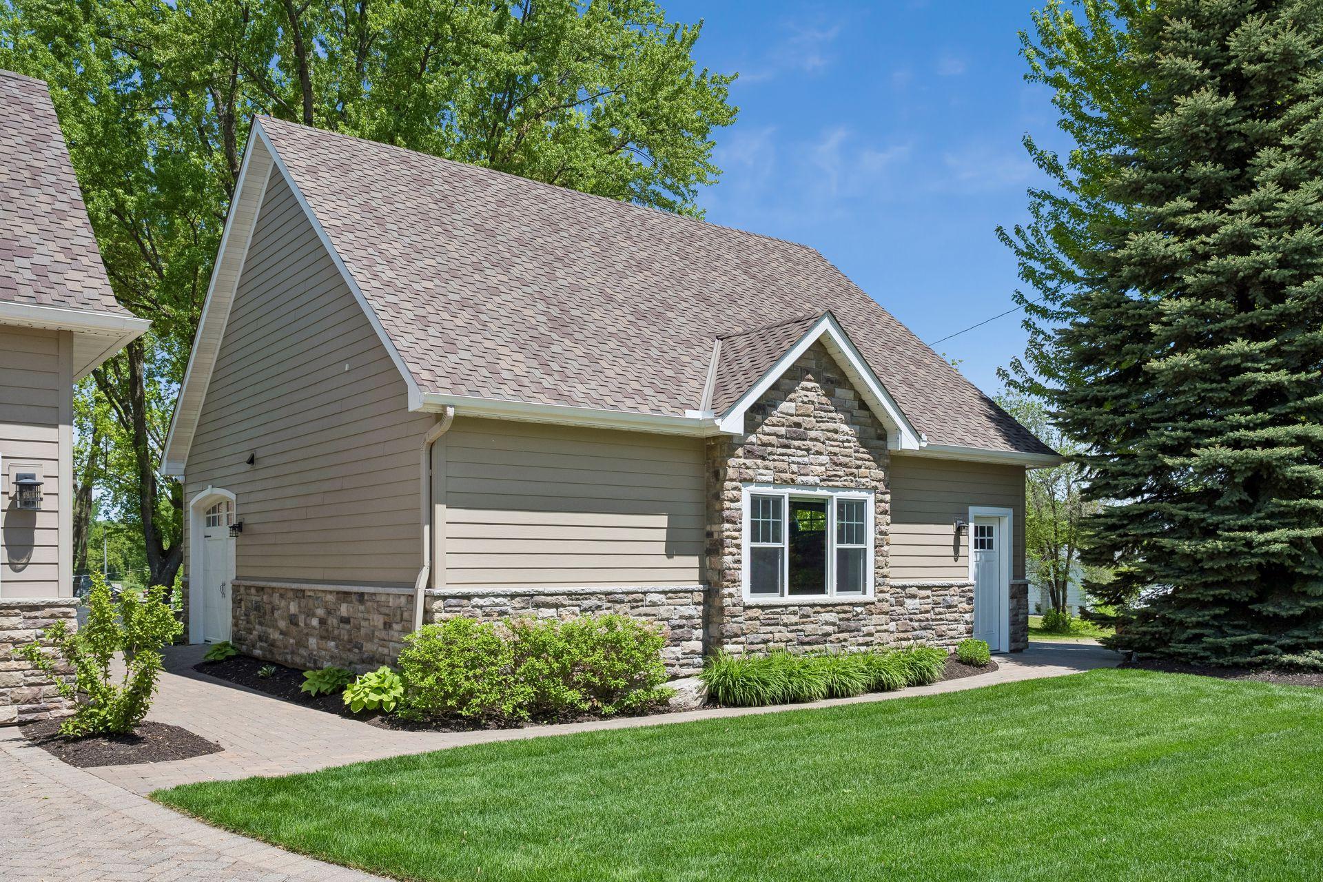 30x30 detached garage with heat & AC. epoxy floors, 1/2 bathroom and bonus space above.