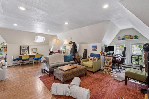 A large space with skylight and recessed lighting