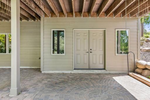 Don't miss the tuck-under garage on the backside of the home, allowing a great place to store off-season patio furniture, seasonal decoration and household items.