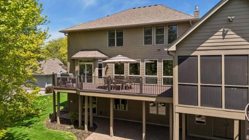 Outdoor living is elevated with a three-season porch, an impressive 40-foot Trex deck, plus the new brick paver patio and flagstone firepit.
