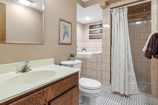 A second full bathroom on the lower level adds extra convenience and flexibility for guests or everyday living. Separate shower and deep bath tub.
