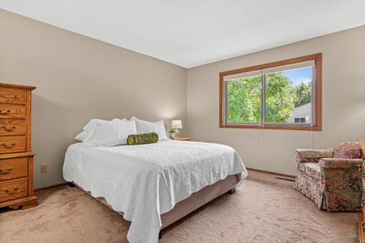 The spacious primary bedroom offers plenty of room for a king-size bed along with additional furniture or a sitting area. Includes a "get ready" area, large closet and walk-through bathroom.