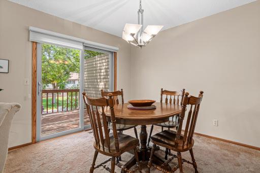 Sliding glass doors provide easy access to the deck, extending your living space outdoors.