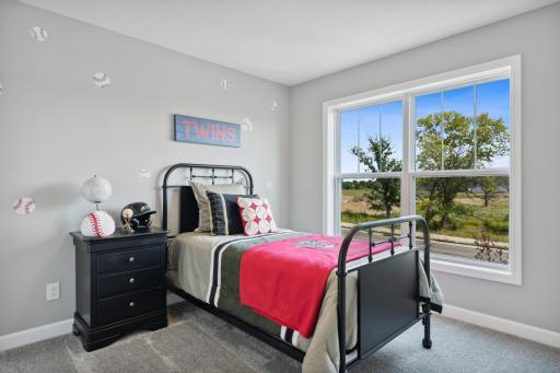 (Photo of a decorated model, actual finishes will vary.) With four bedrooms in total, this home is great for households that need space.