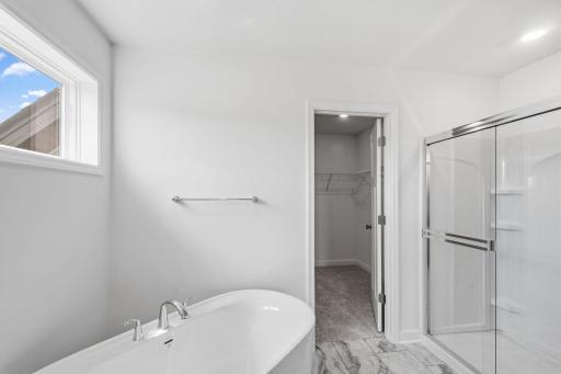 This elegant bathroom has direct access to the walk-in closet, perfect for getting ready throughout the week