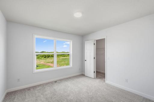 The secondary bedrooms provide spacious and private retreats for household members or overnight guests.