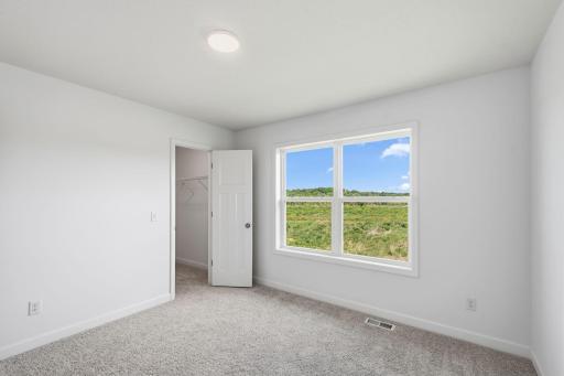Three secondary bedrooms can be found upstairs, just down the hall from the ownerâs suite.