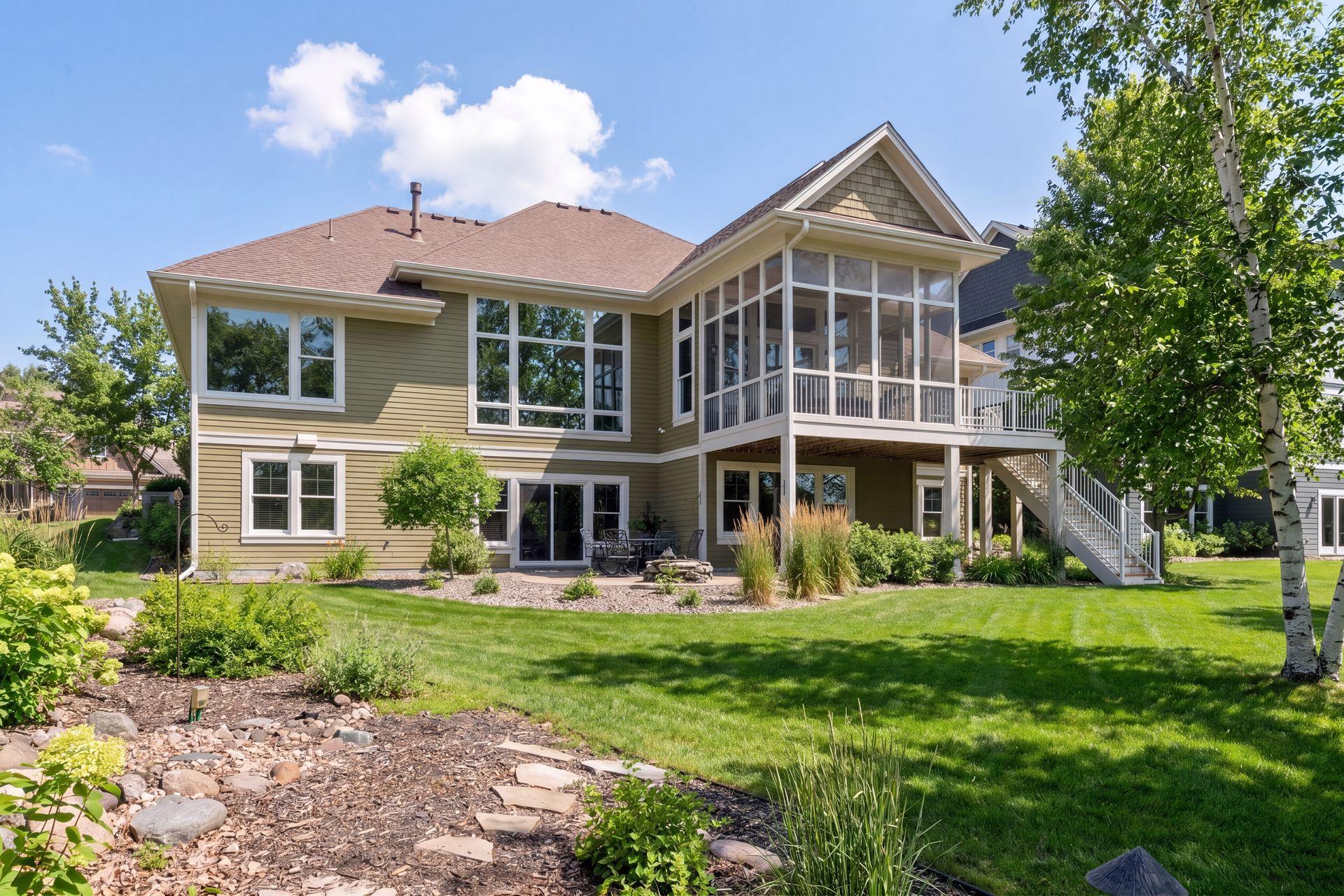 Back of home with patio and water feature