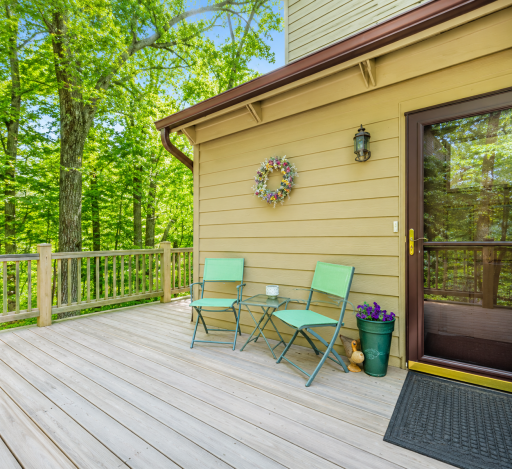 This is a end unit with a huge wraparound porch. Photo Brightened.